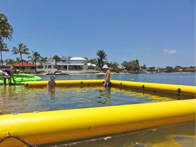 Floating barrier separating swimmers from jet ski zone at beach