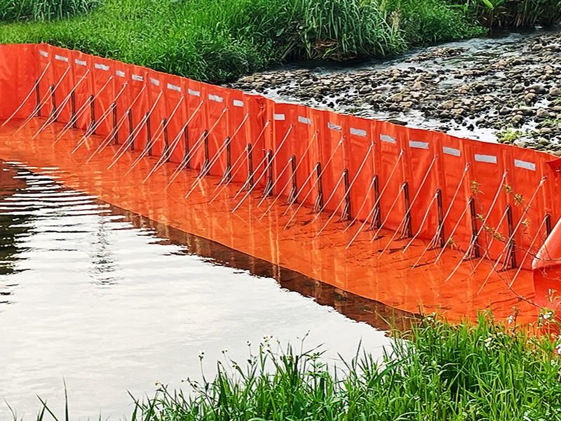 WavePlus L-Shape Flood Barrier installed along roadside for water diversion